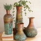 Set of Four Copper Vases